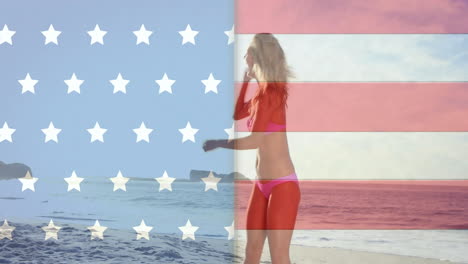 Animation-of-flag-of-usa-over-caucasian-woman-on-beach-in-summer