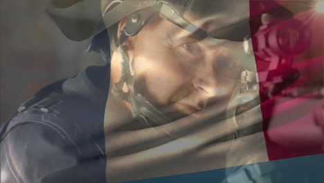 Animation-of-flag-of-france-over-caucasian-male-soldier-holding-weapon