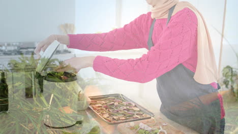 Mujer-Birracial-Con-Hijab-Poniendo-Desechos-De-Pies-En-Un-Contenedor-De-Basura-En-La-Cocina-Sobre-Puntos-De-Luz