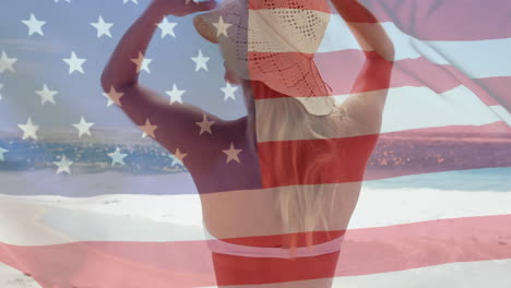 Animation-of-flag-of-usa-over-caucasian-woman-on-beach-in-summer