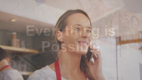 Animation-of-everything-is-possible-text-over-caucasian-woman-using-smartphone