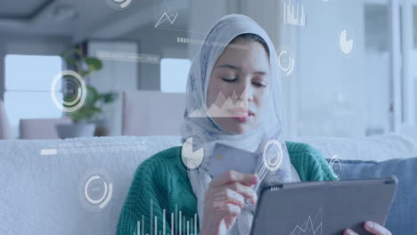 Animation-of-network-of-connections-over-biracial-woman-in-hijab-using-tablet