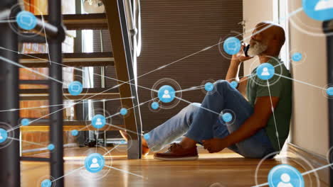 Animation-of-network-of-connections-over-african-american-man-talking-on-smartphone