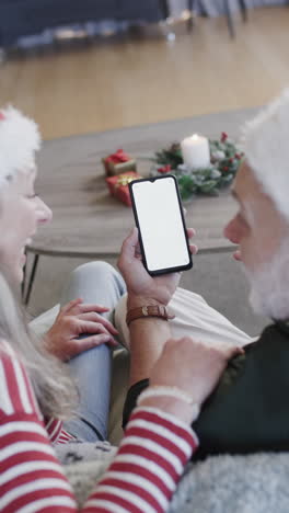 Vertical-video-of-senior-caucasian-couple-using-smartphone-with-copy-space,-slow-motion