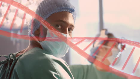 Animation-of-dna-strand-over-biracial-male-surgeons-in-hospital