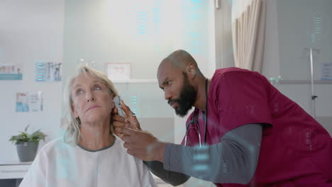 Animation-of-dna-scanner-icons-over-diverse-male-doctor-checking-ear-of-senior-female-patient