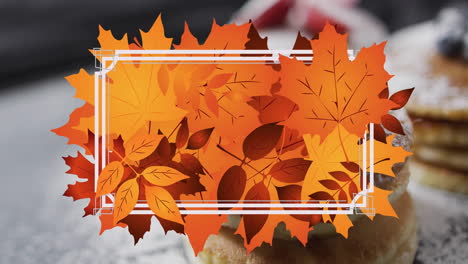 Animation-of-frame-with-fall-leaves-over-pancakes