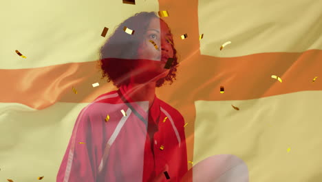 Animation-of-confetti-and-flag-of-england-over-biracial-female-rugby-player