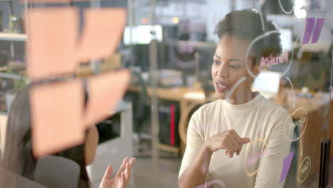 African-American-woman-focuses-on-her-laptop-at-the-business-office