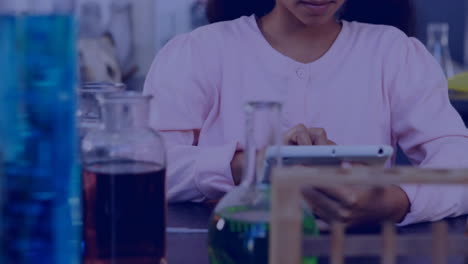 Animation-of-molecules-over-biracial-schoolgirl-working-in-laboratory