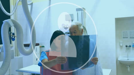 Animation-of-user-icon-over-diverse-doctors-inspecting-xray-in-hospital