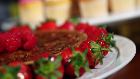 Plate-with-strawberries-and-dessert-on-counter