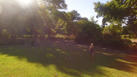 Smiling-woman-running-in-park