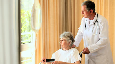 Doctor-with-his-patient-in-a-wheelchair