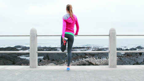 Pretty-young-determined-woman-stretching