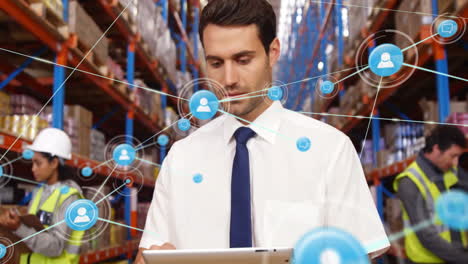 Animation-of-network-of-connections-with-icons-over-caucasian-male-worker-in-warehouse