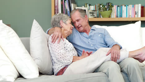 Senior-couple-embracing-in-living-room