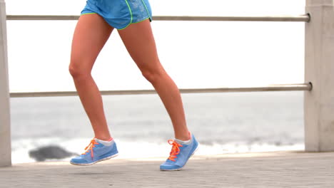 -Female-legs-running-by-the-sea