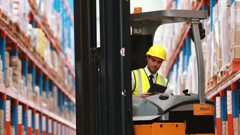 Male-warehouse-worker-using-digital-tablet