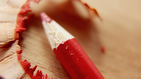 Close-up-of-red-color-pencil-with-pencil-shaving