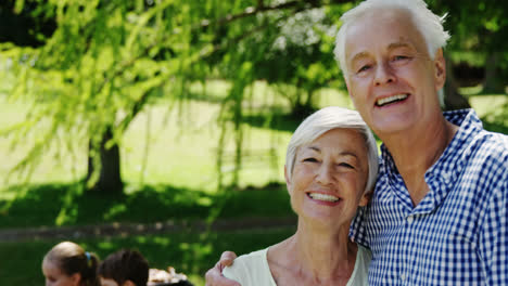 Senior-couple-embracing-each-other-in-the-park