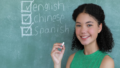 Portrait-of-schoolgirl-pretending-to-be-a-teacher-in-classroom