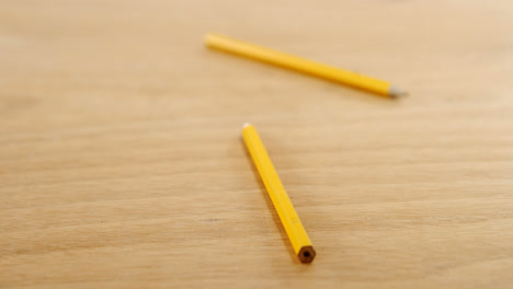 Yellow-colored-pencils-on-wooden-table