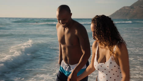 Couple-playing-at-the-beach