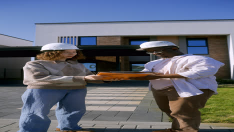 Man-and-woman-with-hardhats-handshaking-at-the-front-yard