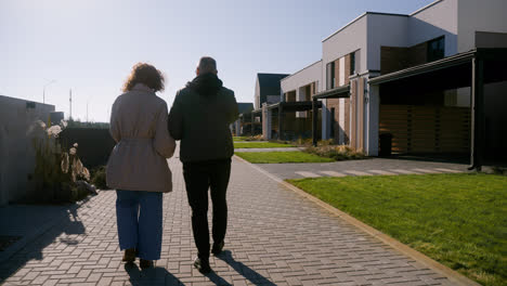 Man-and-woman-walking-around-the-neighbourhood