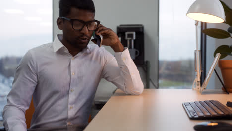 Indian-man-talking-on-the-phone