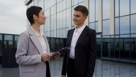 Woman-holding-clipboard