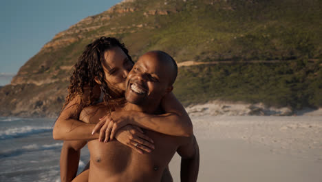 Couple-playing-at-the-beach