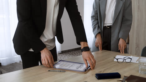 Man-giving-certificate-to-woman