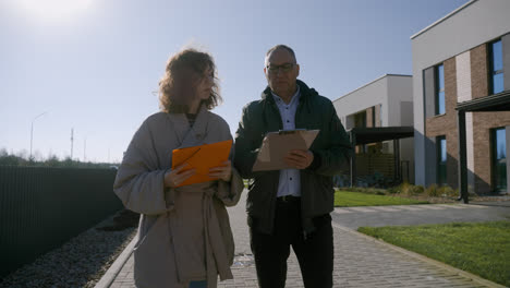 Man-and-woman-walking-around-the-neighbourhood