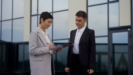 Short-haired-women-outside-the-building