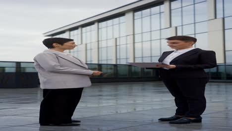 Short-haired-women-outside-the-building