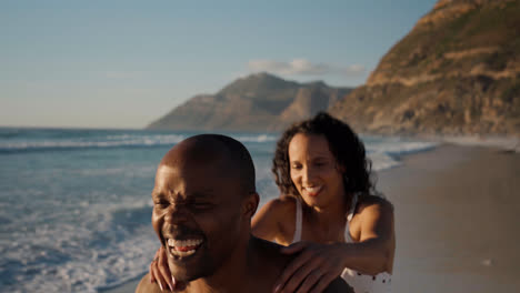 Couple-playing-at-the-beach