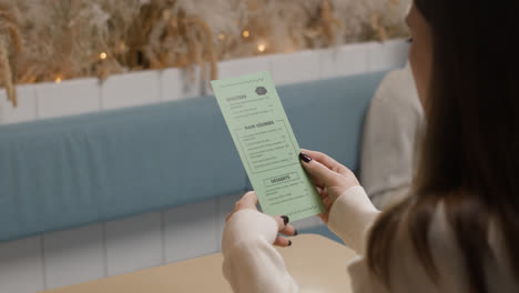 Woman-looking-at-menu