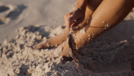 Person-sitting-on-the-beach