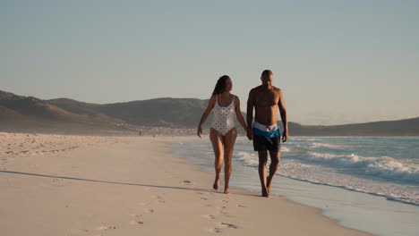 Couple-walking-on-the-seashore