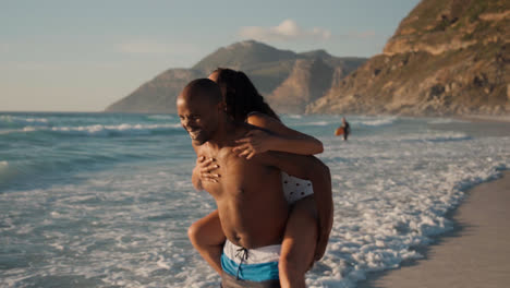 Couple-playing-at-the-beach