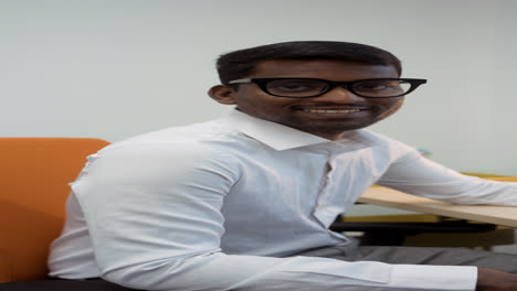 Indian-man-smiling-at-the-office