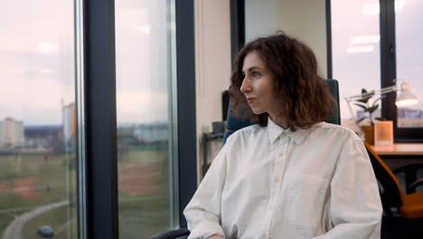 Caucasian-woman-smiling-at-the-office