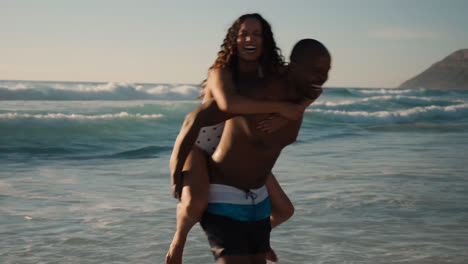 Couple-playing-at-the-beach