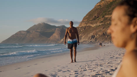 Man-walking-at-the-beach