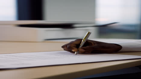 Businessman-signing-paperwork