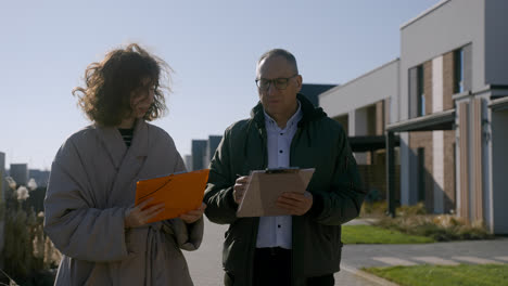 Man-and-woman-walking-around-the-neighbourhood