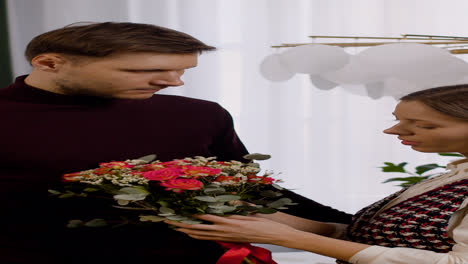 Man-giving-flowers-to-wife