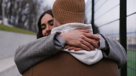 Couple-hugging-outside